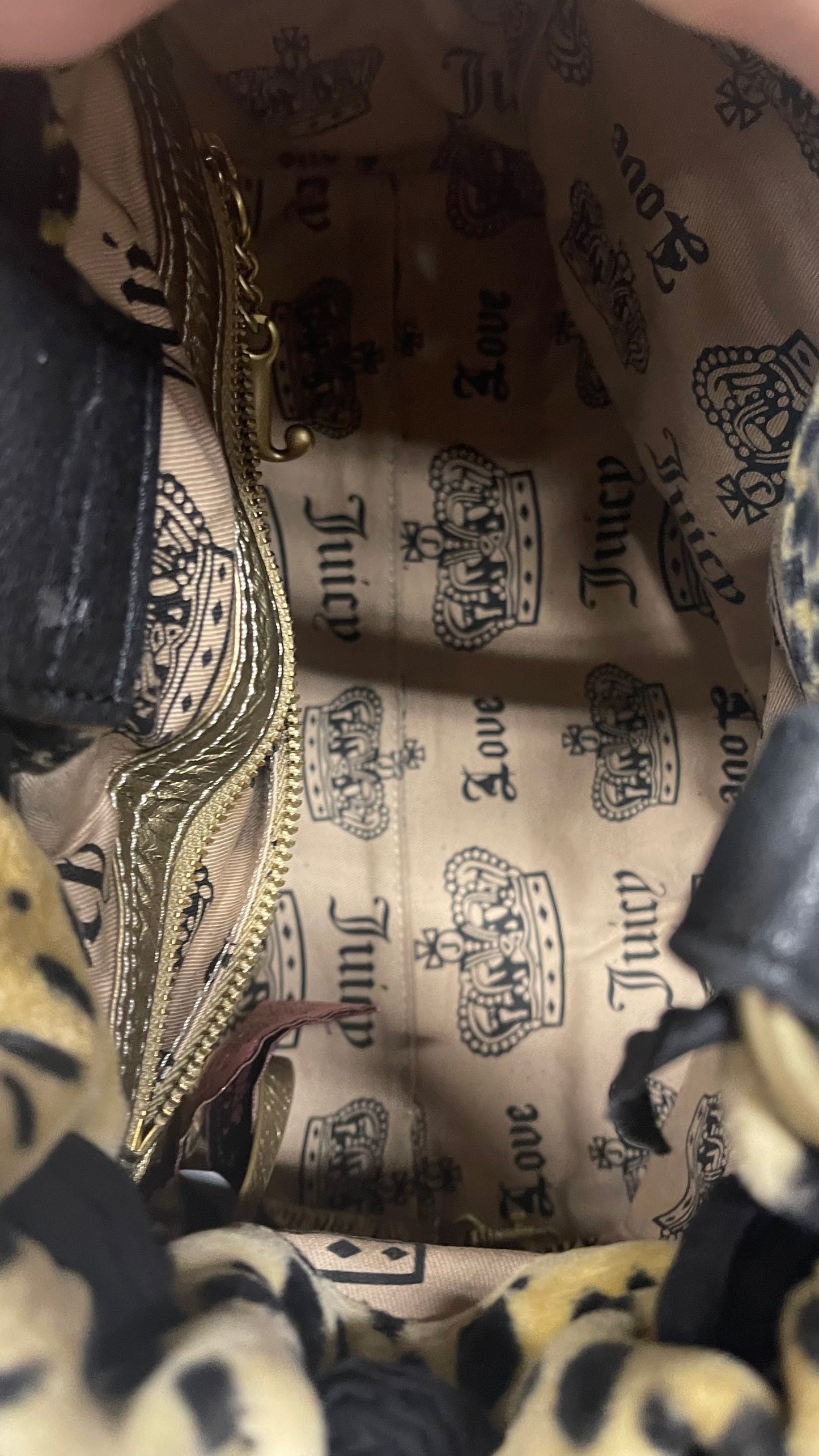 Inside of a vintage Juicy Couture leopard print daydreamer bag